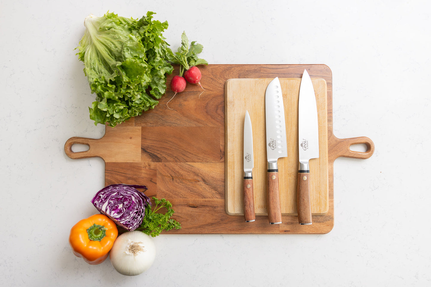 How to Make Your Japanese Knives Last Longer with a display of sharp knives and fresh vegetables on a wooden cutting board.